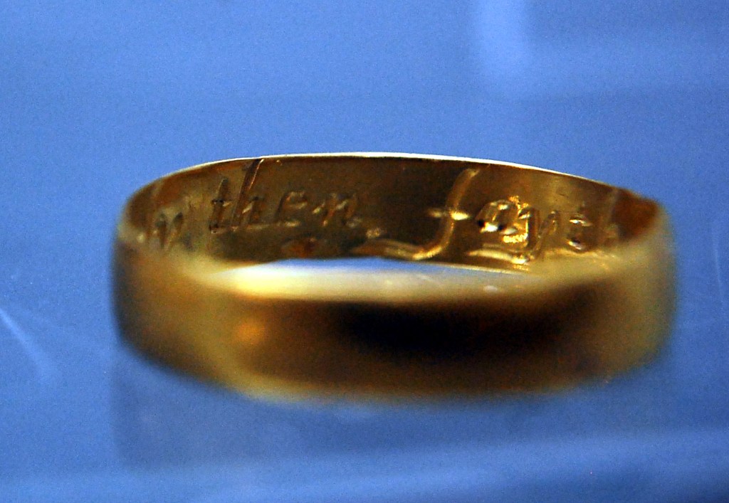 The wording inside one of the posey rings